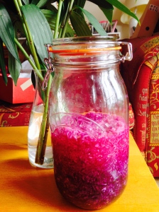 A jar of purple sauerkraut looking jewel-like