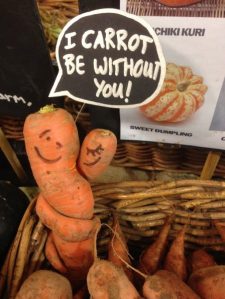 Entwined organic carrots with a label saying: I carrot leave without you!